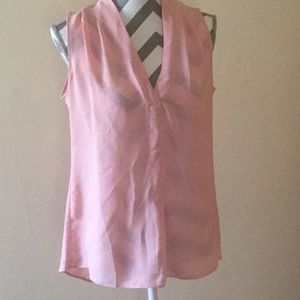 Rose 🌹 and Olivia.  Peach sleeveless light shirt